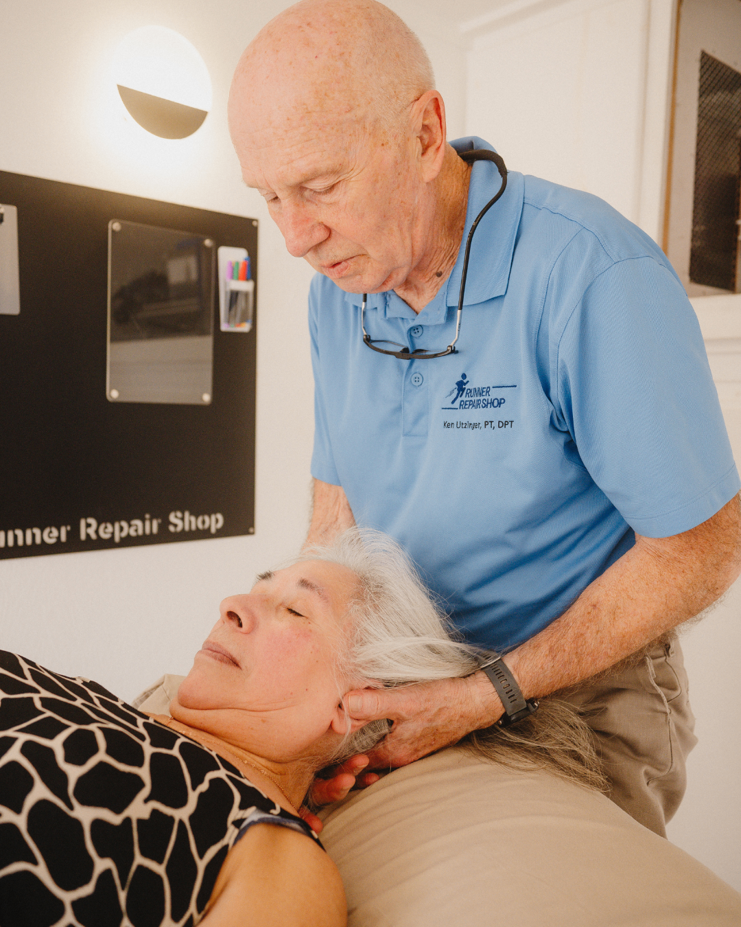Ken Utzinger performing hands-on cervical treatment in the clinic